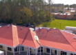 Hammer Down Roofing installing new roof on Promanade Mall in Panama City Florida